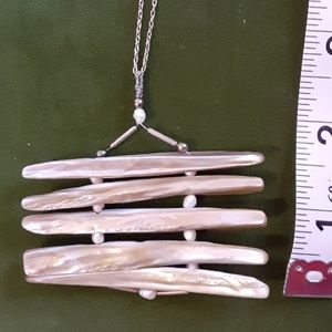 Handmade pendant on chocker chain.